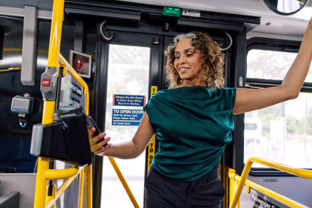 istock Woman tapping to pay bus ride 2176951898