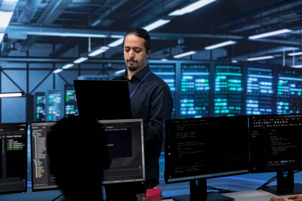 istock Admin in server hub checking recovery plan, monitoring data center 2176953459