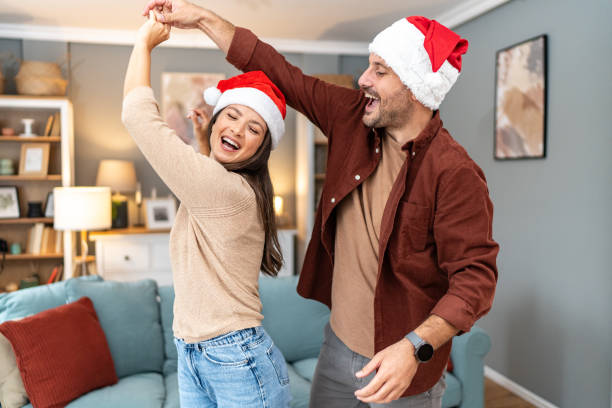 istock Happy couple dancing and having fun at home on Christmas 2176955331