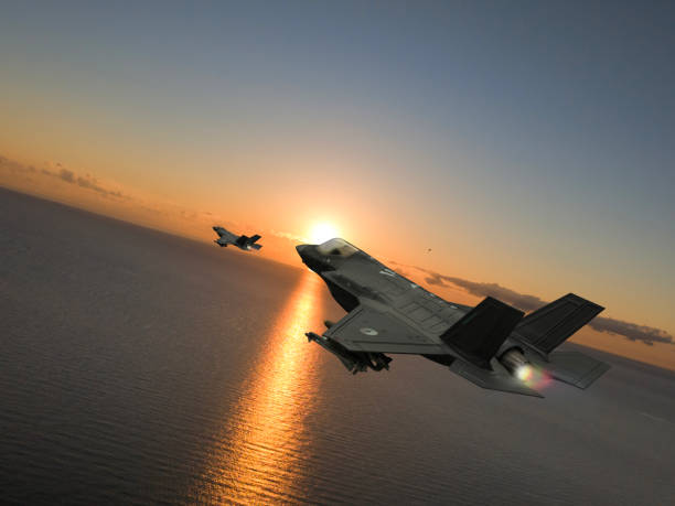 istock F-35 Eagle flying over sea at sunset. 2176956105