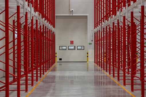 Red White Racking System With Rolling Panel Gate Inside Warehouse Stock ...