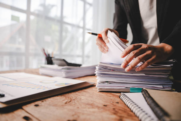 istock Employees who work with documents, search for documents, do income and expense accounting, tax returns, and other heavy workloads. 2176958029