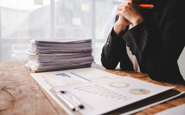 istock Employees who work with documents, search for documents, do income and expense accounting, tax returns, and other heavy workloads. 2176958035