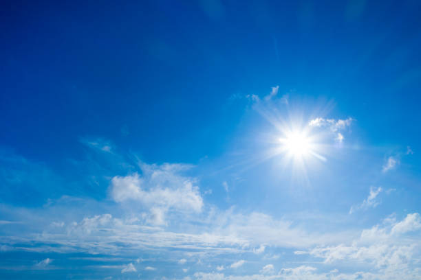 istock white fluffy clouds with rainbow in the blue sky 2176963295