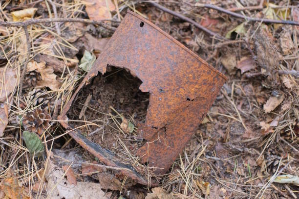 istock one old brown rusty metal tin can with a hole 2176964033
