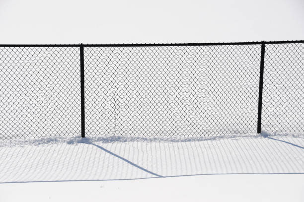 istock Chain link fence in snow 2176964581