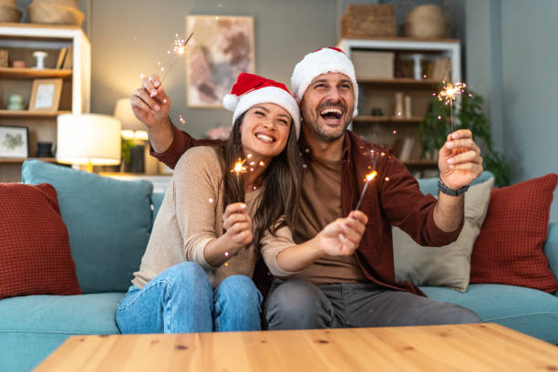 istock Cheerful couple celebrating Christmas Eve 2176969324