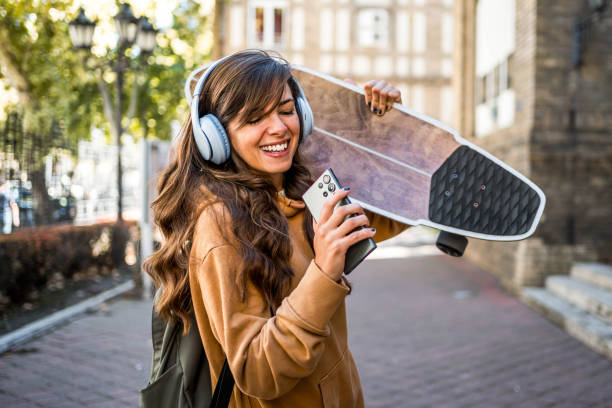 istock Woman with a skateboard in a city 2176972748