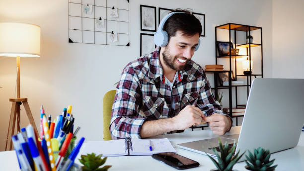 istock Young Caucasian entrepreneur working from home on laptop 2176972931