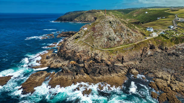 istock Aerial View of Rugged Coastline with Lighthouse in Cornwall, UK 2176979069