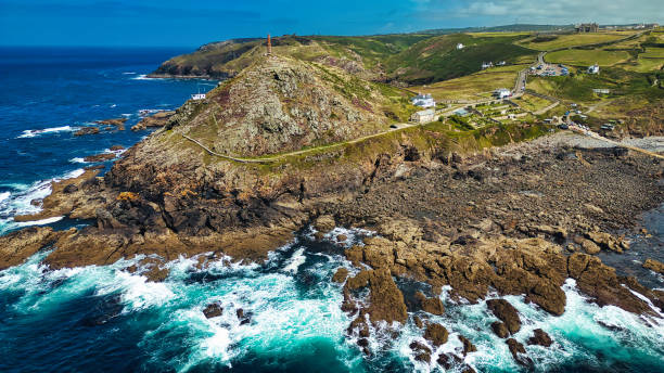 istock Aerial View of Rugged Coastline with Lighthouse in Cornwall, UK 2176979107