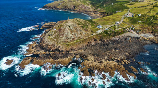 istock Aerial View of Rugged Coastline with Lighthouse in Cornwall, UK 2176979151