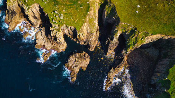 istock Aerial View of Rugged Coastal Cliffs and Ocean at Land's End, Cornwall, UK 2176979559