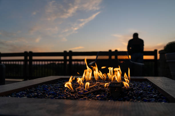 istock Cozy Fire Pit at Sunset with Silhouette in the Background 2176981581