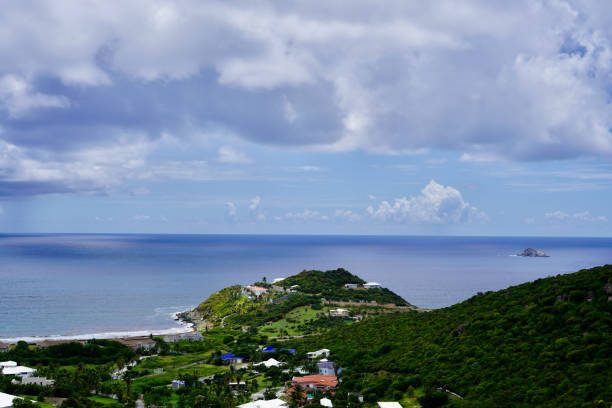 Guana Bay on the east side of St. Maarten is calm on this overcast day, with Pelican Key visible on the right.