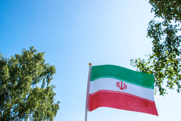 istock Iran national flag high in the sky. Nature background. 2176988568