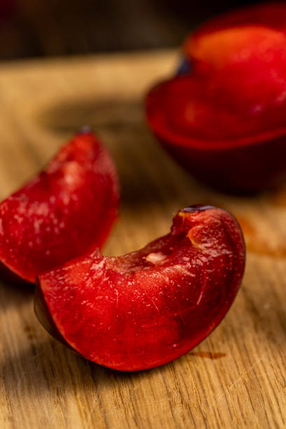 red ripe plum during cooking and slicing