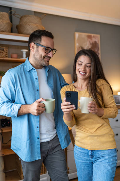 istock Happy couple relaxing together at home 2176993745