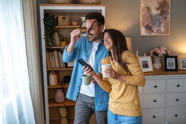 istock Happy couple relaxing together at home 2176993799