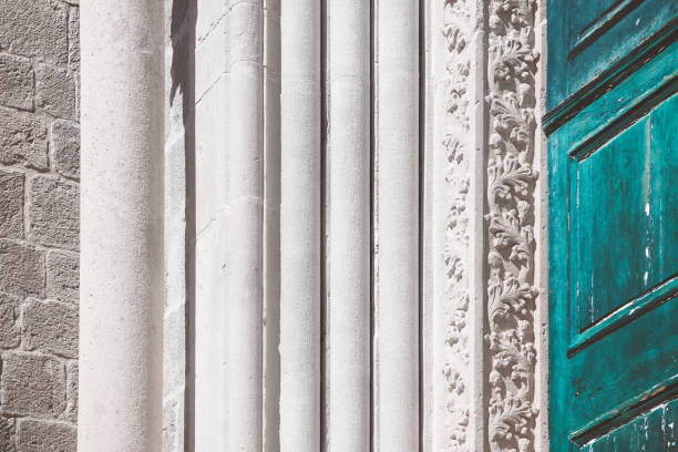 Details of Ornate Carved Marble at Ancient Columns. Stone pillar at the entrance of the old church