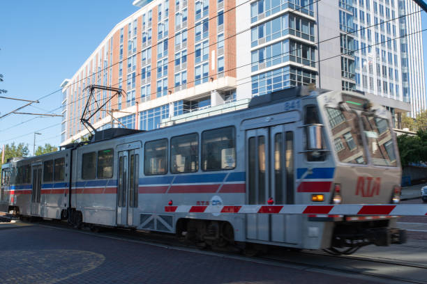The Rapid Transit Authority train passes by along the intersection of West 10th Street and Main Street in the Flats neighborhood of downtown Cleveland Ohio.