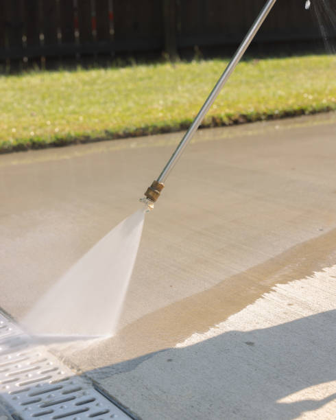 istock Pressure Washing Driveway - Fence Grass Drain - Vertical 2177004879