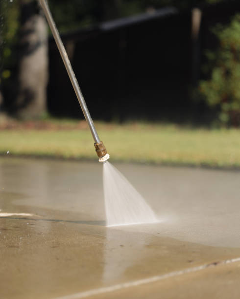 istock Pressure Washing Driveway - Fence and Grass - Vertical 2177005580