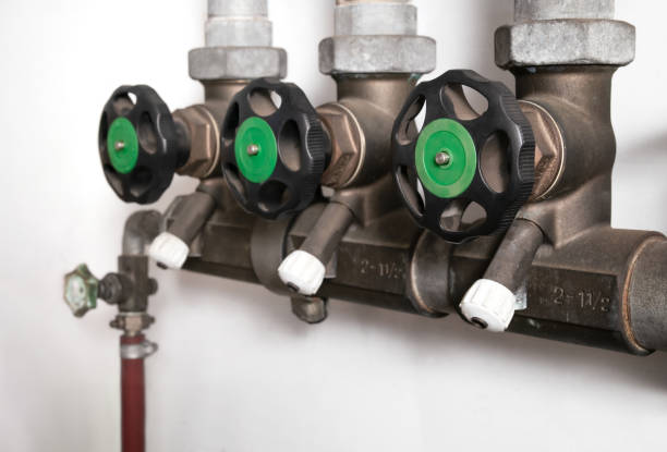 Backwater valve or backflow shut off valve in service room of building.