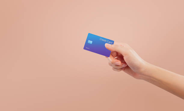 istock Hand holding credit card on isolated background. 2177011527