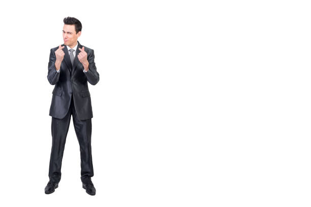 Full body of content rich male in formal suit looking at camera with money gesture isolated on white background in studio
