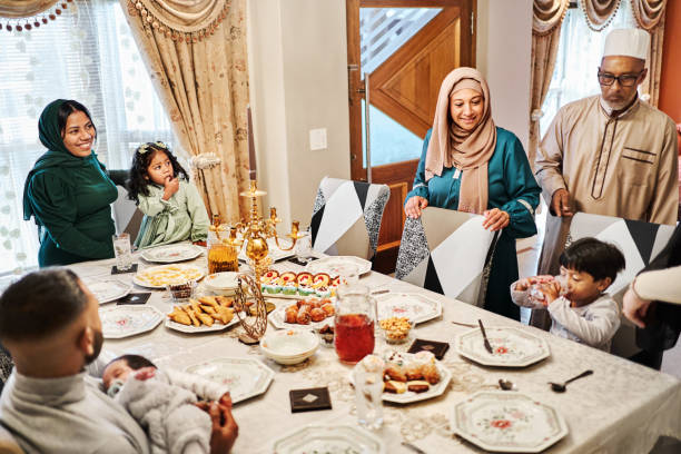 istock Muslim family at dinning table for dinner at home during Ramadan 2177023005
