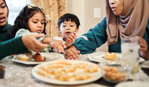 istock Children eating dessert at family dinner during Ramadan 2177023150
