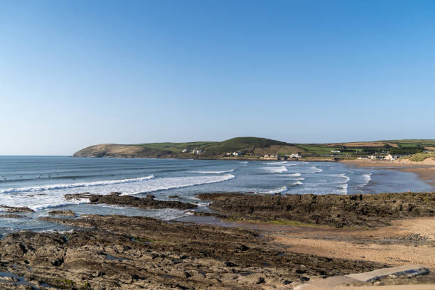 istock Croyde beach with waves and surfers, England 2177027523