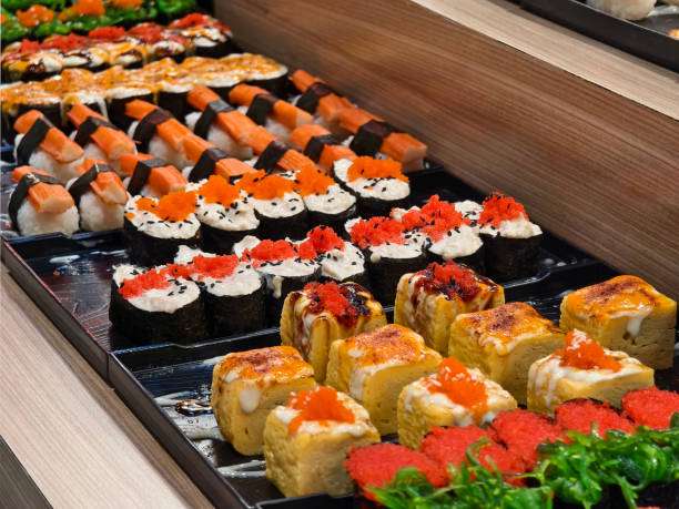 istock Delicious sushi rolls are beautifully arranged on plates 2177028771