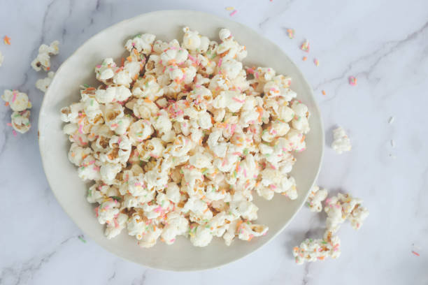 istock white chocolate colorful confetti popcorn in ceramic bowl. 2177031131