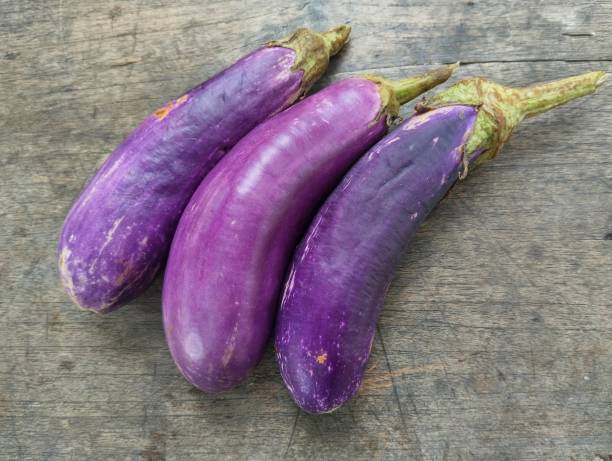 istock Fresh purple Eggplant on the wooden table 2177033235