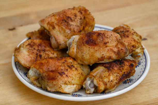 istock Crispy golden chicken thighs stacked on a plate 2177041126