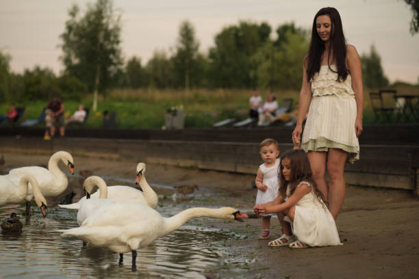 istock A tender exchange between a mother and her child, with nature all around. This image resonates with themes of nurturing through nature. 2177044510