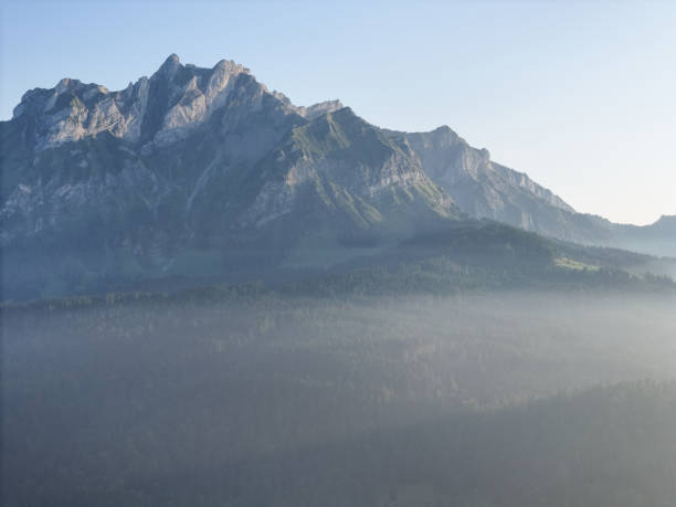 istock Misty Morning Mountain View with Clear Sky 2177045500
