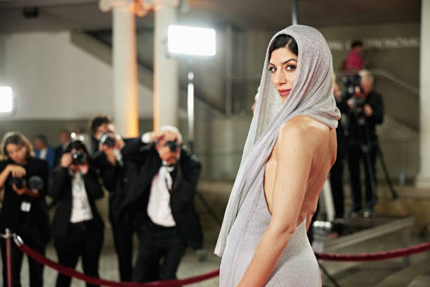 istock Glamorous celebrity in mid 30s pausing to look at camera 2177045798
