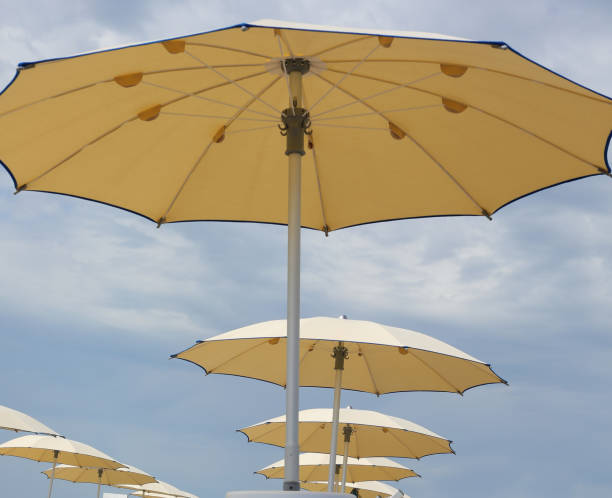 istock many open umbrellas without people and the sky a bit cloudy 2177048042