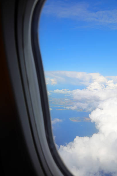 breathtaking view of clouds from high above an airplane window during a transoceanic flight