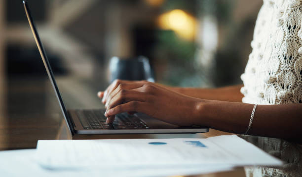 istock A close-up of a woman's hands typing on a laptop. 2177052448