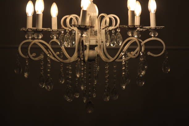 istock A chandelier with five lit candles provides warm and cozy atmosphere 2177054698
