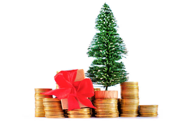 istock Decorative Christmas Tree With Gift Box On Stacks Of Coins 2177055390