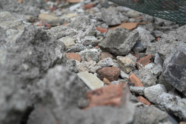 Concrete, brick, and stone fragments create a captivating abstract composition, A study in abstract patterns and unexpected beauty found in the most mundane of places.