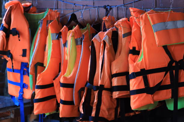 istock A collection of life jackets hanging on a rack, ready for use 2177062527