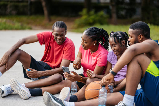 istock Young Black Family Using Phone After A Basketball Game 2177063094