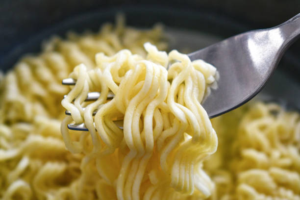 istock Instant noodles in a bowl with a fork. 2177064118