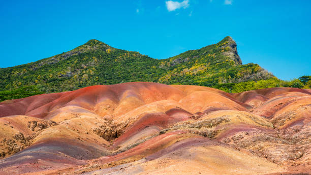 Chamarel Seven Colored Earth Geopark in Mauritius Island. Colorful panoramic landscape about this volcanic geological formation Chamarel Seven Colored Earth Geopark in Riviere noire district.